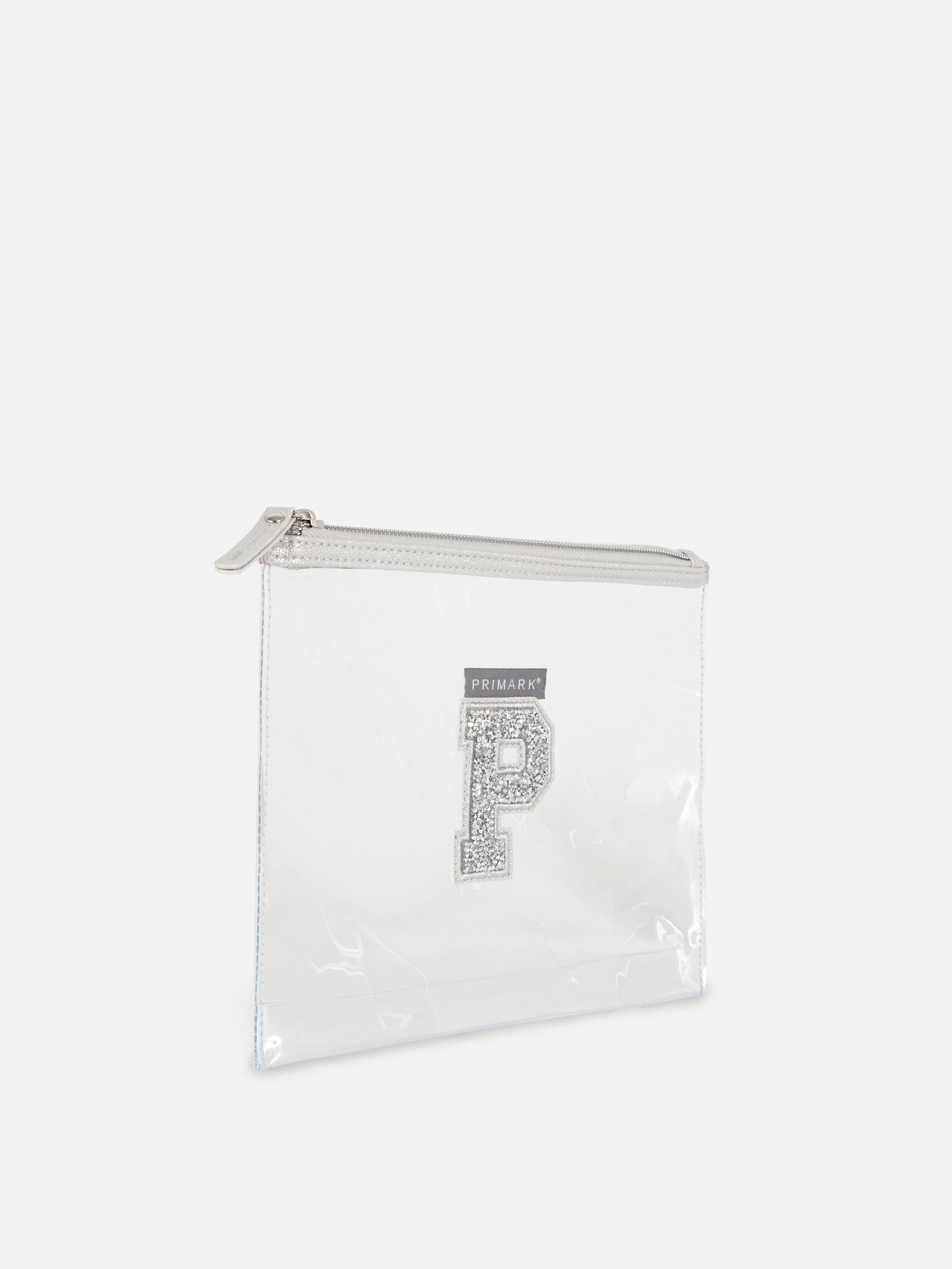 Bolsa transparente con inicial de purpurina