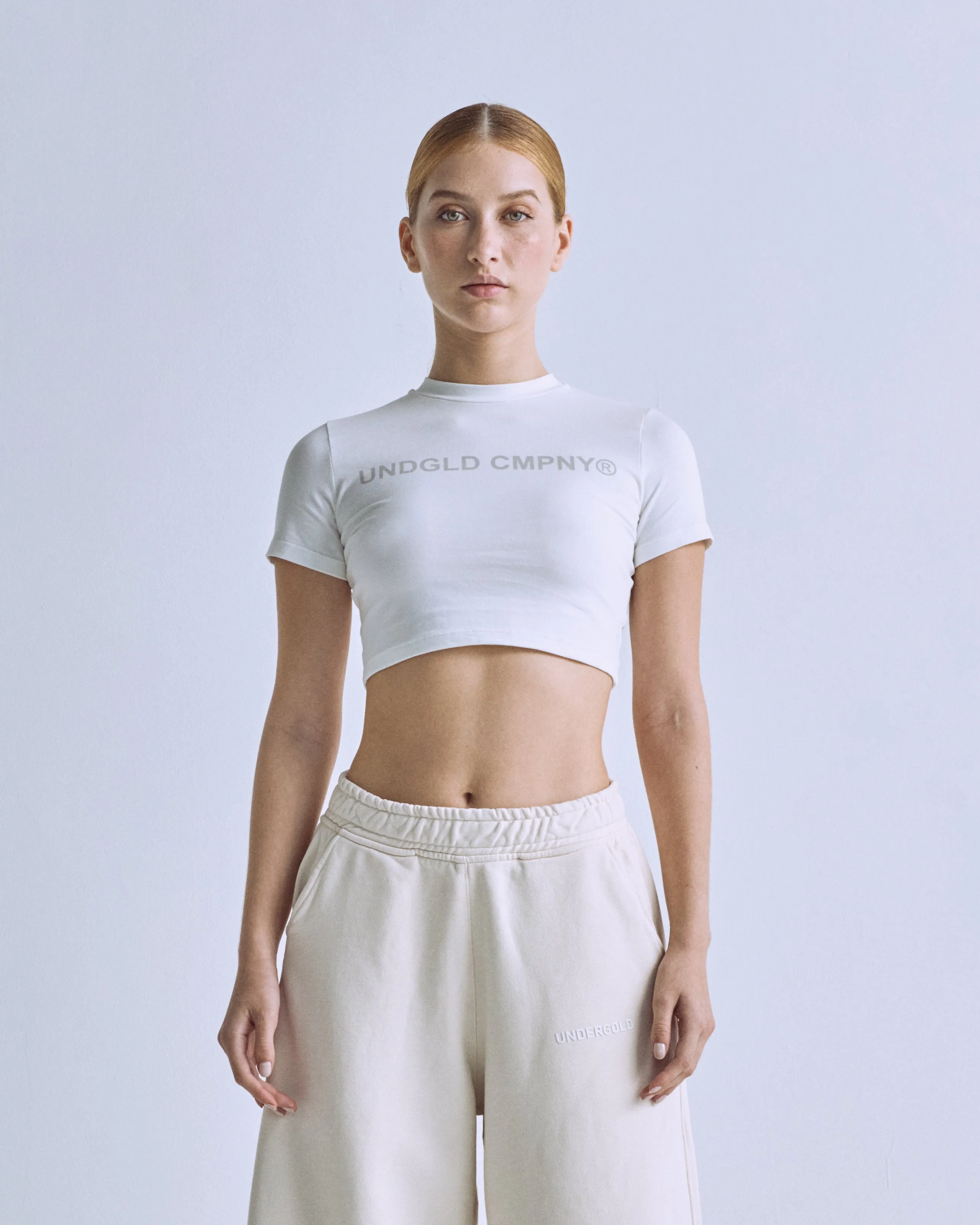 Luminescence UNDGLD CMPNY Baby Tee White